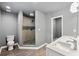 This bathroom includes a toilet, dual sinks, tiled walls, and a walk-in shower at 2991 Black Bear Se Dr, Marietta, GA 30067