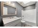 This bathroom includes a vanity, sink, and a bathtub with tiled walls at 2991 Black Bear Se Dr, Marietta, GA 30067