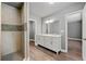 Modern bathroom featuring a tiled shower, double vanity, and wood-look flooring at 2991 Black Bear Se Dr, Marietta, GA 30067