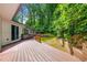 Spacious wood deck with a backyard view and lush greenery at 2991 Black Bear Se Dr, Marietta, GA 30067