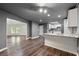 Updated kitchen featuring white cabinets, stainless appliances, granite countertops and hardwood floors at 2991 Black Bear Se Dr, Marietta, GA 30067