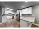 Modern kitchen with stainless steel appliances, granite countertops, white cabinets, and a skylight at 2991 Black Bear Se Dr, Marietta, GA 30067
