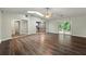 Bright living room featuring wood floors, a skylight, ceiling fan, and open access to the kitchen at 2991 Black Bear Se Dr, Marietta, GA 30067
