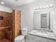 Modern bathroom features a granite vanity top and tiled shower with built in bench at 35 Riverbend Dr, Covington, GA 30014