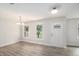 Bright living room with stylish gray flooring, white walls, and natural light streaming through the windows at 35 Riverbend Dr, Covington, GA 30014