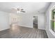 Bright and spacious living room with gray wood-look flooring and plenty of natural light at 35 Riverbend Dr, Covington, GA 30014