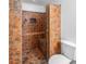 Stylish tiled shower with built-in bench, adding convenience and luxury to the bathroom at 35 Riverbend Dr, Covington, GA 30014