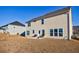 A spacious backyard with a well-maintained lawn and a patio area, perfect for outdoor entertaining at 807 Parker Pass, Peachtree City, GA 30269
