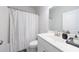 Clean, well-lit bathroom features modern fixtures and a stylish shower curtain at 807 Parker Pass, Peachtree City, GA 30269
