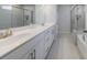 Well-lit bathroom with double vanity, white countertops, and a separate glass-enclosed shower at 807 Parker Pass, Peachtree City, GA 30269