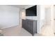 Bedroom with dresser and wall-mounted TV, offering a relaxing retreat at 807 Parker Pass, Peachtree City, GA 30269