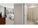 Bedroom with ensuite bathroom featuring a window and wood dresser at 807 Parker Pass, Peachtree City, GA 30269