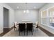 Bright dining room with modern chandelier and neutral decor at 807 Parker Pass, Peachtree City, GA 30269