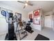 Fully-equipped home gym with exercise machines, framed jerseys, and a comfortable carpet at 807 Parker Pass, Peachtree City, GA 30269