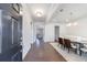 Inviting foyer with dark wood floors leading to a dining room and living space at 807 Parker Pass, Peachtree City, GA 30269