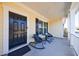 Cozy front porch featuring two chairs and a small table, perfect for relaxing at 807 Parker Pass, Peachtree City, GA 30269