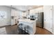 Bright kitchen with an island, stainless steel appliances, and white cabinetry at 807 Parker Pass, Peachtree City, GA 30269