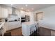 Modern kitchen with white cabinets, stainless steel appliances, and a quartz island at 807 Parker Pass, Peachtree City, GA 30269