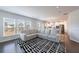 Open living space with a large, comfortable sectional sofa perfect for relaxing and entertaining at 807 Parker Pass, Peachtree City, GA 30269