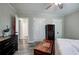 Bright bedroom featuring wood-look floors, a ceiling fan, and closet doors at 3156 Pope Rd, Douglasville, GA 30135