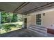 Covered carport area with adjacent storage and house entrance, offering shelter and functionality at 3156 Pope Rd, Douglasville, GA 30135