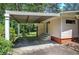 Attached carport offering covered parking, complemented by a side door for convenient access to the home at 3156 Pope Rd, Douglasville, GA 30135