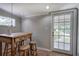 Bright dining area featuring a rustic table and outdoor views at 3156 Pope Rd, Douglasville, GA 30135