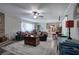 View of living room showcasing brick fireplace, hardwood floors, and ceiling fan at 3156 Pope Rd, Douglasville, GA 30135