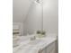 Bathroom with single sink, mirror, and bright lighting at 3754 Berkeley Xing, Duluth, GA 30096