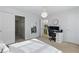 Spacious bedroom with doors to closets and bathroom, a large window, and neutral colors at 3754 Berkeley Xing, Duluth, GA 30096