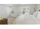 Bedroom with double windows, a double closet and a light neutral color palette at 3754 Berkeley Xing, Duluth, GA 30096