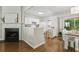 Open-concept kitchen with white cabinets and modern appliances at 3754 Berkeley Xing, Duluth, GA 30096