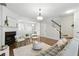 Bright living room with fireplace and seamless flow to dining area at 3754 Berkeley Xing, Duluth, GA 30096