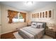 Comfortable bedroom featuring stylish curtains, neutral decor, and soft lighting, creating a relaxing atmosphere at 2556 Defoors Ferry Nw Rd, Atlanta, GA 30318