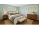 Serene bedroom with natural light, featuring shuttered windows, a cozy bed, and neutral tones for ultimate relaxation at 2556 Defoors Ferry Nw Rd, Atlanta, GA 30318