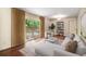 Inviting living room with hardwood floors, a comfortable sofa, and sliding glass doors that provide natural light at 2556 Defoors Ferry Nw Rd, Atlanta, GA 30318