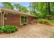 Brick ranch house featuring a brick patio in the backyard at 2559 Defoors Ferry Nw Rd, Atlanta, GA 30318