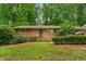 Charming brick home with a well-manicured front yard and a cozy, inviting entrance at 2559 Defoors Ferry Nw Rd, Atlanta, GA 30318