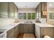 Well-lit kitchen featuring ample counter space, natural light, and vintage cabinets at 2559 Defoors Ferry Nw Rd, Atlanta, GA 30318