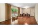 Open living room with hardwood floors, neutral walls, and sliding glass door to the backyard at 2559 Defoors Ferry Nw Rd, Atlanta, GA 30318
