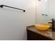 Bathroom featuring a brown vanity with an ornate bowl sink and modern faucet at 3260 Ridgefair Dr, Cumming, GA 30040