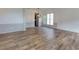 Bright living room with wood-look floors, chair rail molding, neutral paint, and great natural light at 3260 Ridgefair Dr, Cumming, GA 30040