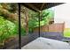 Covered patio area overlooking the backyard with lush greenery and trees at 3260 Ridgefair Dr, Cumming, GA 30040