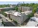 A nice aerial view of the apartment building with its well-maintained facade, featuring a mix of gray and brick elements at 660 Glen Iris Dr # 206 & 109, Atlanta, GA 30308