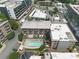 Aerial view featuring a sparkling swimming pool, lounge area, and manicured landscaping within the apartment complex at 660 Glen Iris Dr # 206 & 109, Atlanta, GA 30308