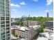 An overhead view of the apartment building near the cityscape, highlighting its roof and proximity to the city at 660 Glen Iris Dr # 206 & 109, Atlanta, GA 30308