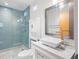 This bathroom features a glass-enclosed shower and a modern vanity with a square sink at 660 Glen Iris Dr # 206 & 109, Atlanta, GA 30308