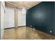 Modern bedroom with dark accent wall, polished concrete floors, and contemporary lighting at 660 Glen Iris Dr # 206 & 109, Atlanta, GA 30308