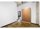 Modern bedroom with wood floor, a large wardrobe, and view to another room at 660 Glen Iris Dr # 206 & 109, Atlanta, GA 30308