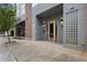 Exterior of building entrance with glass brick, planters, and modern architecture at 660 Glen Iris Dr # 206 & 109, Atlanta, GA 30308